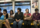 People on Bus with Cellphones